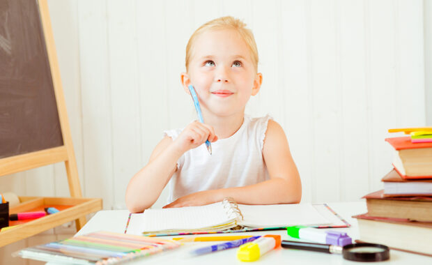 A young girl doing homework.