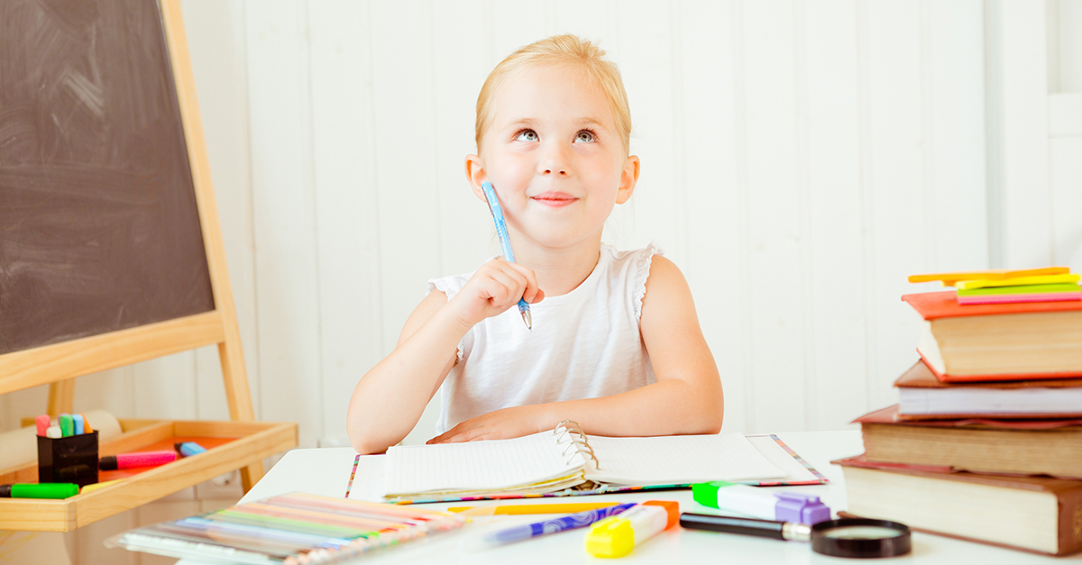 A young girl doing homework.