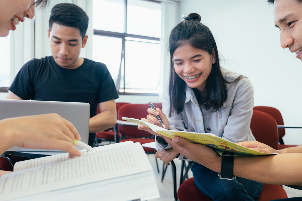 A group of college students study together.