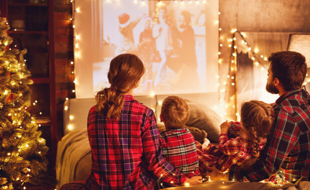 A family watches a holiday movie together.