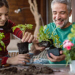 A father and child gardening together.