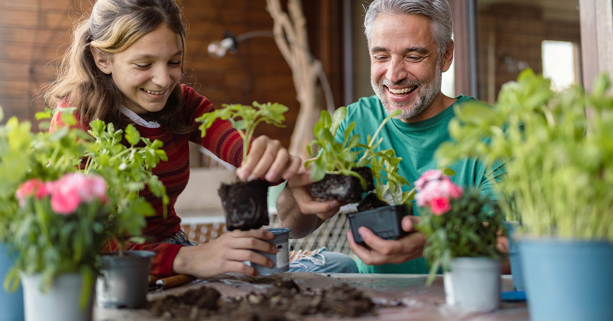 A father and child gardening together.