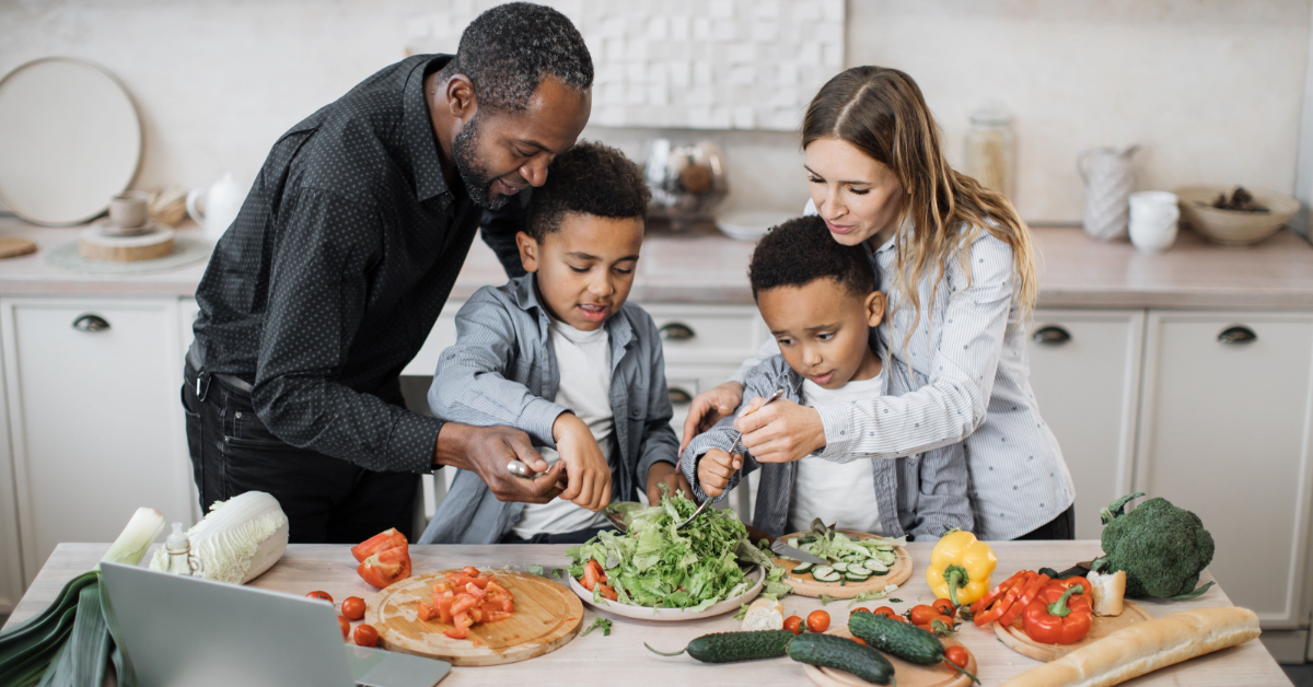 A family preparing a meal together.