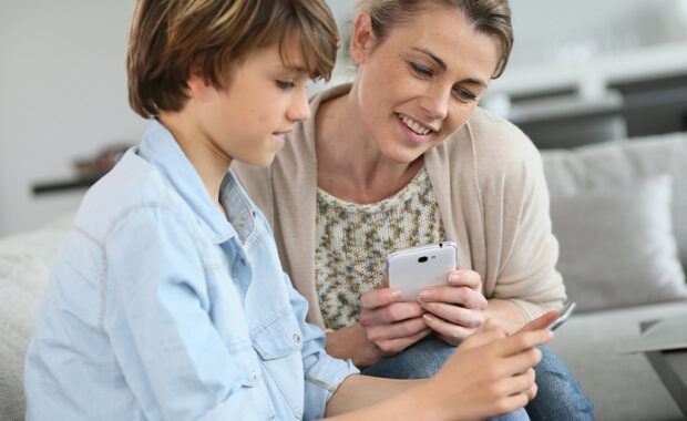 A parent talks to their child about screen time.