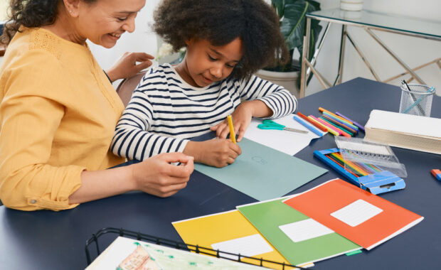 A mother and child doing homework together.