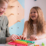 Two students working on a math project together