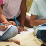 Students doing homework outside