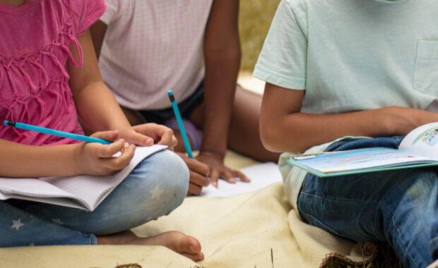 Students doing homework outside