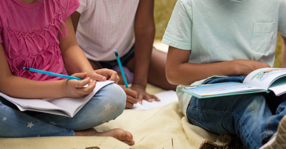 Students doing homework outside