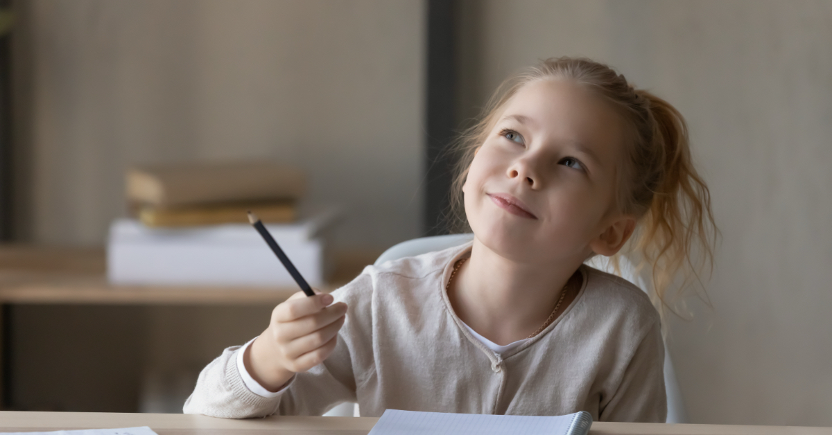 A student writing on a piece of paper