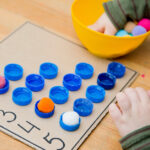 A young student doing sensory math play