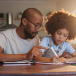 A father and son doing math homework together