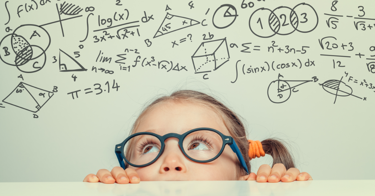 A young student looking at math symbols