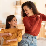 A mother and daughter dancing