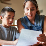 A student looking at a piece of paper