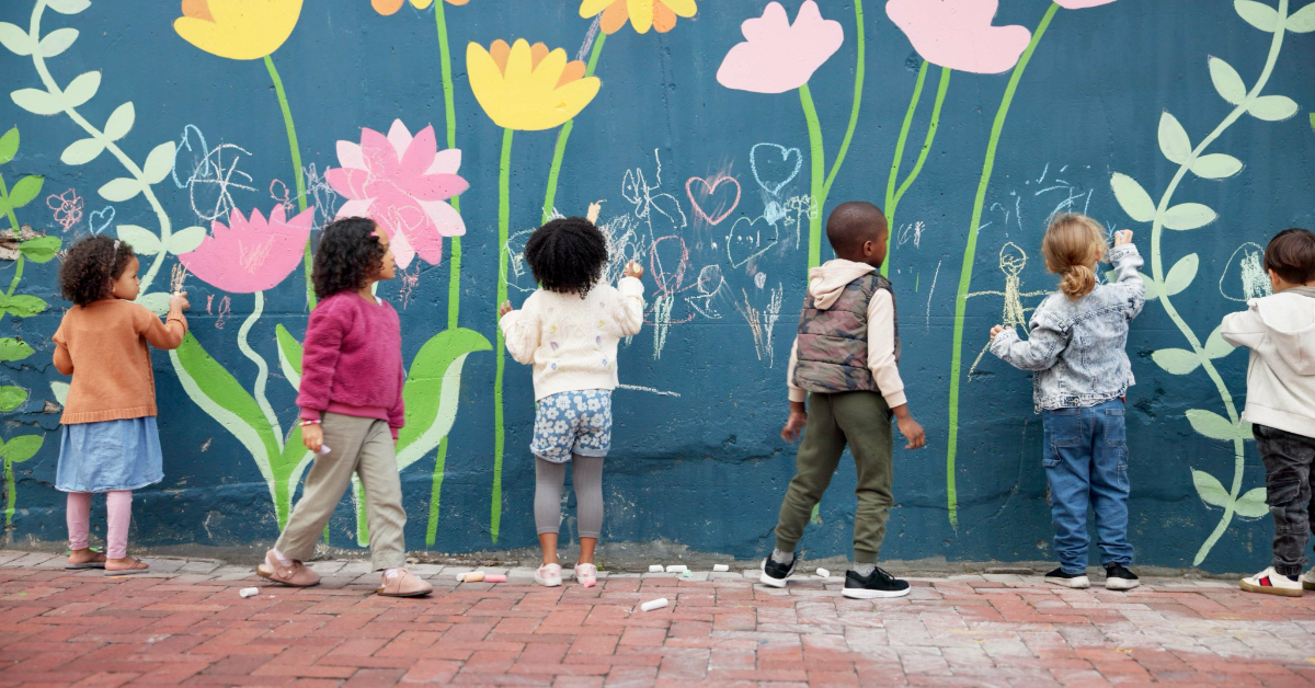 A group of students painting a mural