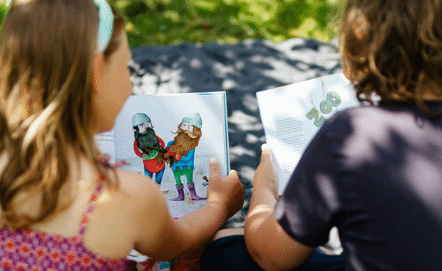 Students reading books outside