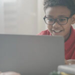 A student working on a laptop computer
