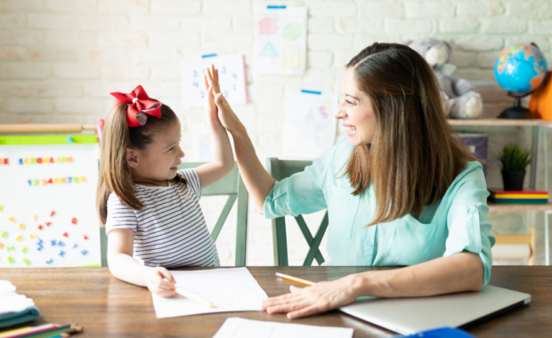 A homeschool teacher and student doing homework together