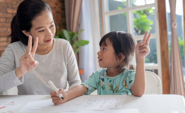 A teacher and student working on math