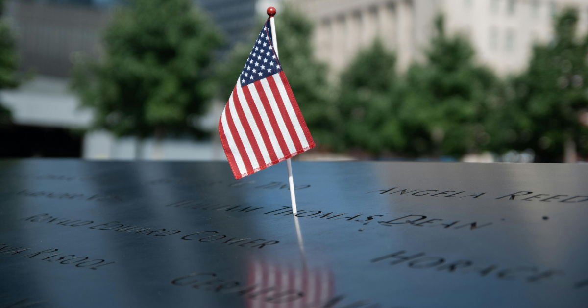 An American flag over a memorial