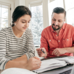 A parent helping their child with homework