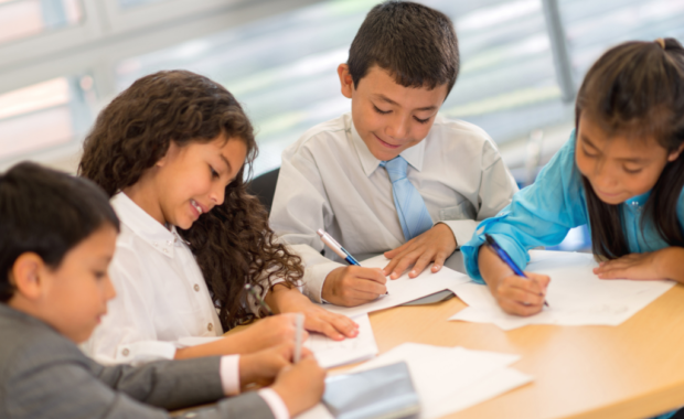 Students working on a grammar project together